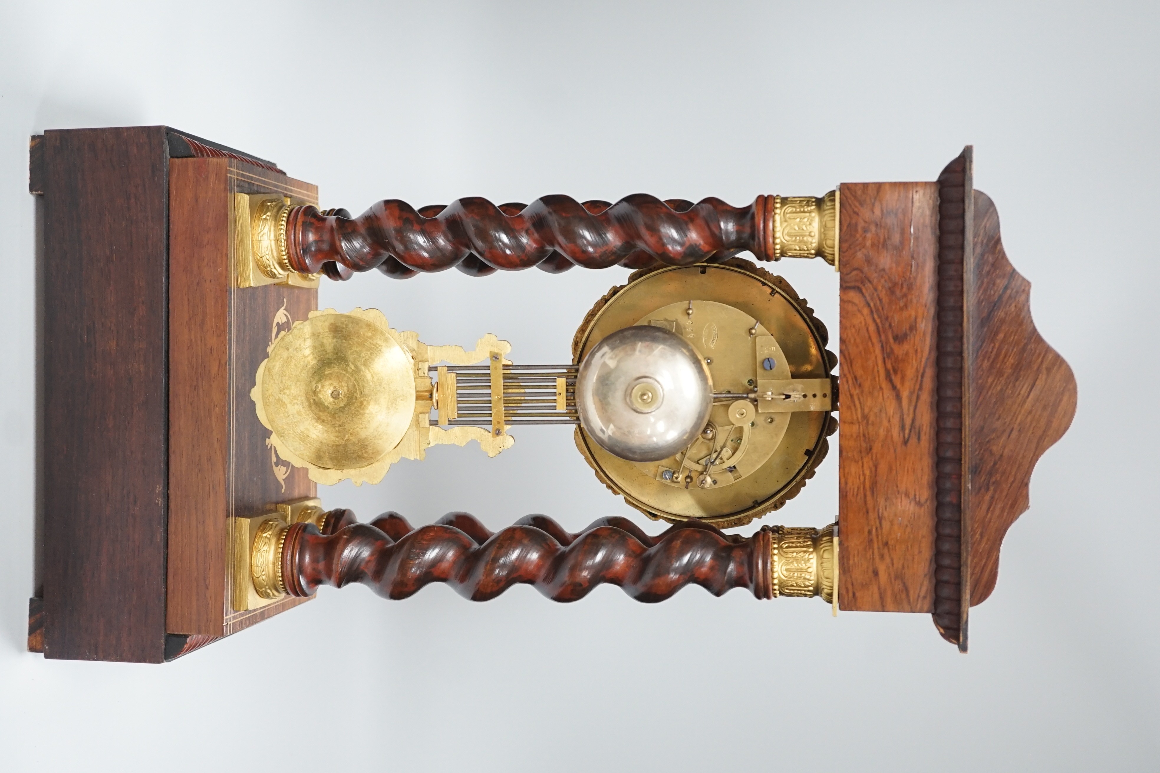 A 19th century Napoleon III rosewood inlaid and ormolu mounted portico clock, 47cms high